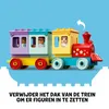 A colorful toy train with figures inside, set against a plain blue background. Podgląd zdjęcia produktu