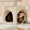 Two cats are playing on a beige cat tree. Podgląd zdjęcia produktu