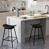 A modern kitchen with a white island and two black bar stools. Podgląd zdjęcia produktu