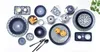 A collection of blue and white patterned tableware, including plates, bowls, teacups, and teapots, arranged on a white background. Produktbild-Vorschau