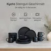A collection of black ceramic tableware set on a countertop with a neutral background. Voir les images du produit