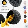 A collage-style marketing image showcasing a 3D printed dragon egg with a dragon emerging, alongside various color options of the same product. Produktbild-Vorschau
