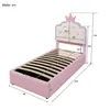 A pink princess-themed bed with a crown detail on the headboard, shown with dimensions indicated by measurement lines and numbers. Produktbild-Vorschau