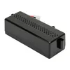 A black electronic device with ventilation holes on top, shown from a diagonal angle against a white background. Produktbild-Vorschau