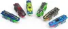 A collection of colorful, insect-like robotic toys arranged on a white background. Náhled obrázku produktu