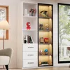 A tall, white bookshelf with a glass-fronted cabinet section, displaying various collectible figures and books. The scene is set in a well-lit room with a window and a lamp visible. Voir les images du produit