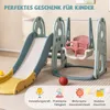A children's play structure with a slide and swing set, set up indoors on a carpeted floor. Anteprima dell’immagine prodotto