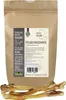 A brown paper bag of dog treats with some treats in the foreground. Produktbild-Vorschau