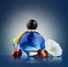 A perfume bottle is displayed with decorative elements. Náhľad obrázku produktu