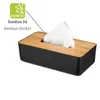 A black tissue box with a bamboo lid, showing tissues emerging from the top. Náhled obrázku produktu
