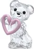A clear, professional studio shot of a crystal bear figurine holding a pink heart. Produktbild-Vorschau