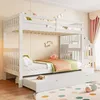 A white bunk bed with a pull-out trundle bed in a child's bedroom, decorated with colorful bunting and toys. Voir les images du produit