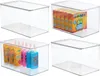 Four clear storage boxes with lids, some containing items like crayons and bottles. Produktbild-Vorschau