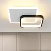 A modern ceiling light fixture with two overlapping square frames, one white and one black, mounted on a white ceiling. Produktbild-Vorschau