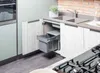 A kitchen scene with a pull-out trash bin under the sink. Produktbild-Vorschau