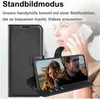 A woman is holding a smartphone in a black flip case, which is propped up to display a video of a couple. Produktbild-Vorschau