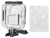 A clear plastic protective case for a camera and a small bag of accessories on a white background. Produktbild-Vorschau