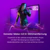 A woman singing into a microphone in front of a large screen displaying a "4K ULTRA HD" logo and a purple gradient background. Voir les images du produit