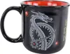 A black ceramic mug with a red interior, featuring a white dragon design. Produktbild-Vorschau