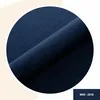 A close-up view of dark blue velvet fabric folded in a circle. Anteprima dell’immagine prodotto