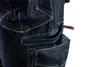 A close-up view of dark blue denim work shorts with multiple pockets and zippers. Produktbild-Vorschau