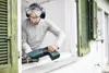 A man is using a reciprocating saw to cut through a window frame. Voir les images du produit
