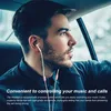 A man driving a car while wearing earphones. Produktbild-Vorschau