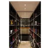 A long, narrow wine cellar with shelves filled with wine bottles on both sides. Produktbild-Vorschau