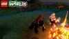 A scene from the video game LEGO Worlds, featuring characters and a campfire. Produktbild-Vorschau