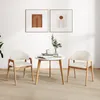 A minimalist living room scene with two chairs and a small table. Podgląd zdjęcia produktu