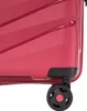 Close-up of the bottom corner of a red suitcase, showing one of its wheels. Náhľad obrázku produktu