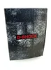A close-up shot of a G-Shock watch box with a distressed black and white pattern and a red G-Shock logo. Náhľad obrázku produktu