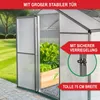 A greenhouse with plants inside, shown outdoors in a garden setting. Produktbild-Vorschau