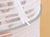 Close-up of a white mesh drying net with a zipper. Produktbild-Vorschau