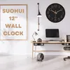 A modern home office setup with a desk, computer, lamp, and a wall clock. Produktbild-Vorschau