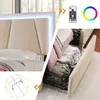 A split image showing a bed headboard with LED lighting and a close-up of storage drawers filled with linens. Produktbild-Vorschau