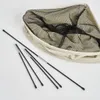 A disassembled laundry hamper with poles laid out next to it. Produktbild-Vorschau