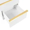 A close-up view of an open drawer on a white dresser with gold trim. Produktbild-Vorschau
