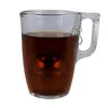 A glass mug filled with tea, containing a tea infuser. Produktbild-Vorschau