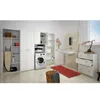 A laundry room with white cabinets, a washing machine, and various storage solutions. Produktbild-Vorschau