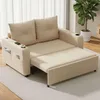 A beige sofa bed is shown in a living room setting, with its footrest extended. Produktbild-Vorschau