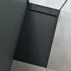 A top-down view of a black shower tray in a modern bathroom setting with gray walls and floor. Produktbild-Vorschau