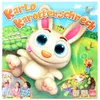The image is the packaging for a board game called "Karlo Karottenschreck". It features a cartoon rabbit and children playing. The background is a grassy field with trees. Produktbild-Vorschau