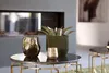 A living room scene with decorative items on a coffee table. Podgląd zdjęcia produktu
