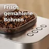 Close-up of a coffee machine's bean hopper and control panel. Voir les images du produit