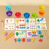 A collection of Montessori math learning toys, including number cards, colorful counting beads, and sorting cups, arranged on a light brown surface. Produktbild-Vorschau