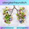 An artistic representation of lungs made of flowers and branches, with text overlays. Produktbild-Vorschau
