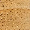 Close-up of water droplets on a wooden surface. Produktbild-Vorschau