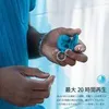 A person's hand holding a pair of blue earbuds. Anteprima dell’immagine prodotto