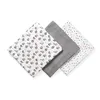 Three baby swaddles are laid out diagonally on a white background. Produktbild-Vorschau